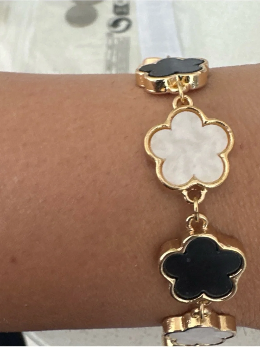 Gold Flower Link Bracelet with Black and White Enamel Accents